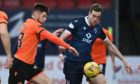 Dundee United midfielder Calum Butcher battles with Jordan White.