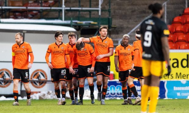 Lawrence Shankland (No 24) is congratulated by his Dundee United team-mates after notching his second goal in last Saturday's 3-0 win over Livingston.