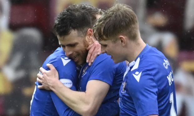 Guy Melamed celebrates his first goal with his team-mates.