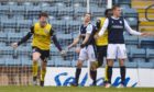 Queen of the South's Rhys Breen celebrates making it 2-0 at Dens Park.