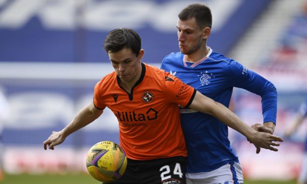 Lawrence Shankland in action against Rangers' Borna Barisic on Sunday.