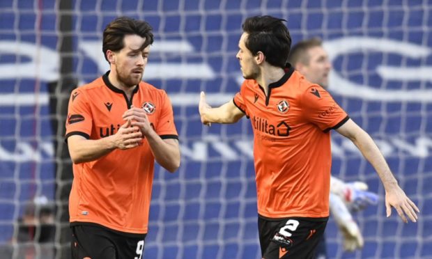 Marc McNulty (left) celebrates his goal against Rangers with Dundee United team-mate Liam Smith.
