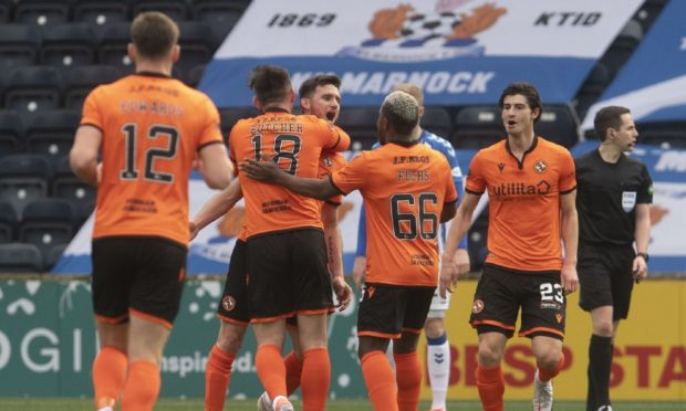 Adrian Sporle (centre) is congratulated by his team-mates after opening the scoring at Rugby Park.