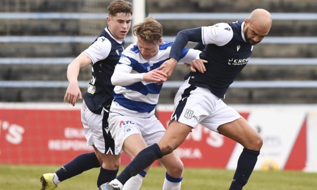 Dundee's Liam Fontaine battles for the ball.