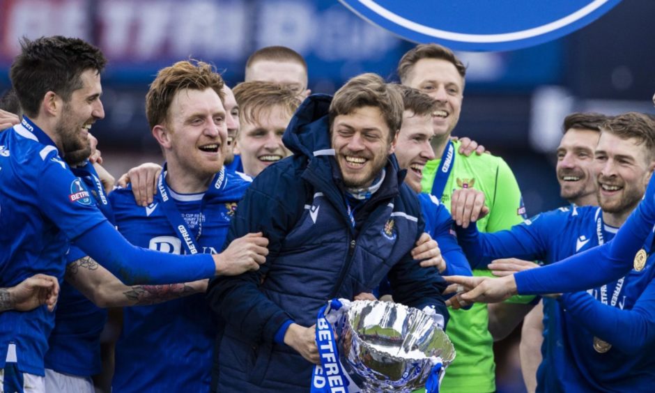 GLASGOW, SCOTLAND - FEBRUARY 28: St Johnstone's Murray Davidson lifts the Betfred Cup trophy during the Betfred Cup final between Livingston and St Johnstone at Hampden Stadium on February 28, 2021, in Glasgow, Scotland. (Photo by Alan Harvey / SNS Group)