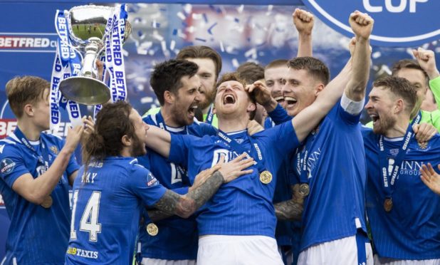 The victorious St Johnstone squad with their new silverware.