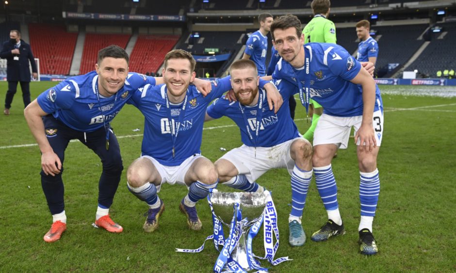 GLASGOW, SCOTLAND - FEBRUARY 28: St Johnstone's Michael O'Halloran, Jamie McCart, Shaun Roonet and Craig Bryson (l-R) with the Betfred Cup trophy during the Betfred Cup final between Livingston and St Johnstone at Hampden Stadium on February 28, 2021, in Glasgow, Scotland. (Photo by Rob Casey / SNS Group) **Free for first use ; 0ca92c10-791e-4a1b-ac60-347126e929a0