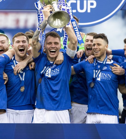 St Johnstone captain Jason Kerr lifts the Betfred Cup.