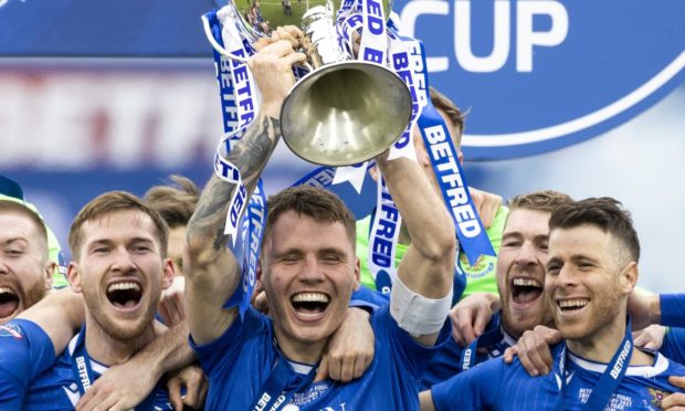 St Johnstone captain Jason Kerr lifts the Betfred Cup.