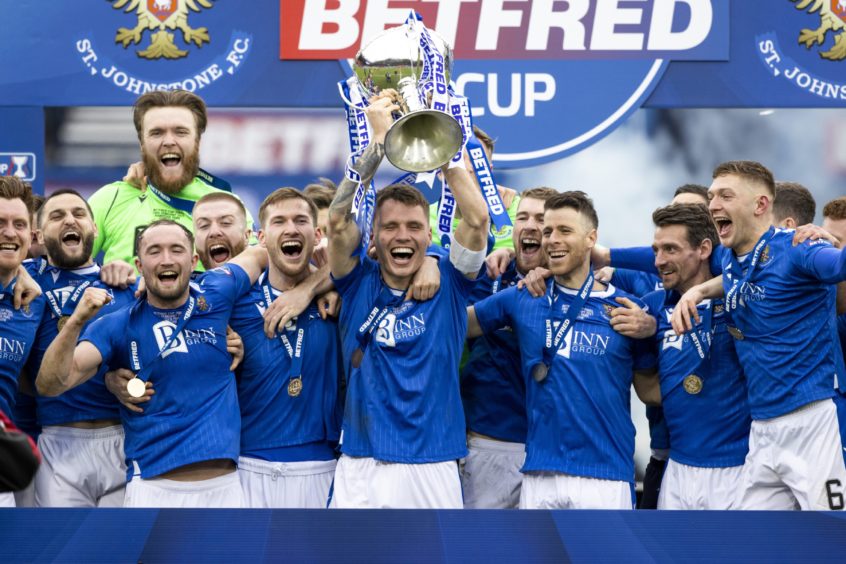 St Johnstone captain Jason Kerr lifts the trophy.