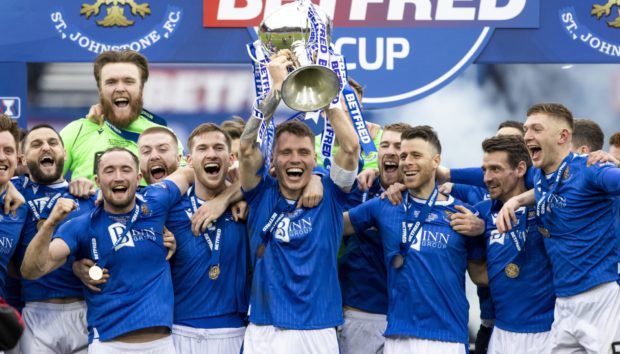 St Johnstone captain Jason Kerr lifts the trophy.