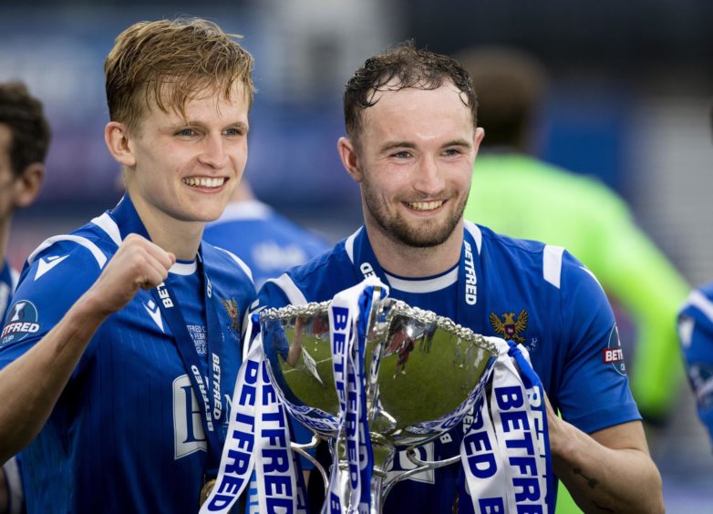 Ali McCann and Chris Kane with the trophy after St Johnstone's League Cup win in 2021.