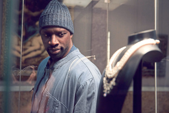 Omar Sy as Assane Diop in Lupin.