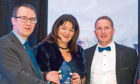 ACCOLADE: NFU Scotland chief executive Scott Walker presents Margaret Hebbourn and Marc Robb with the award in 2020 as the Perth office excels in its work.