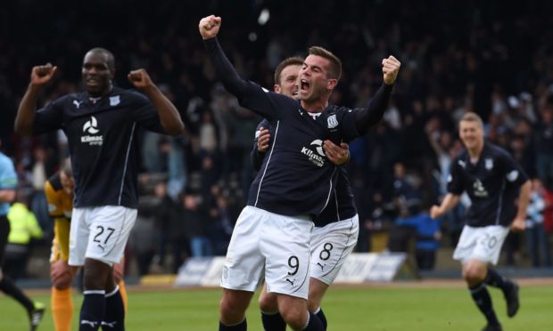 Peter MacDonald celebrates as Dundee are crowned winners of the Championship in 2014.