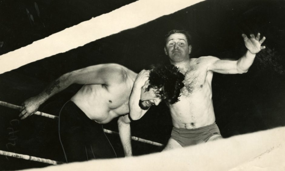 George Kidd wrestles Ivor Penzekoff at Dundee's Caird Hall in January 1965.