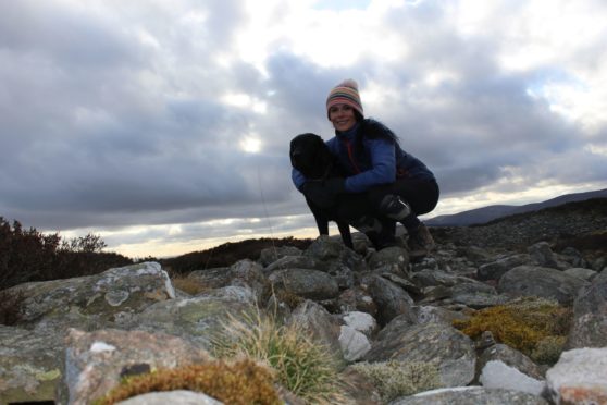 Gayle and dog Toby head up the Caterthuns in Angus.