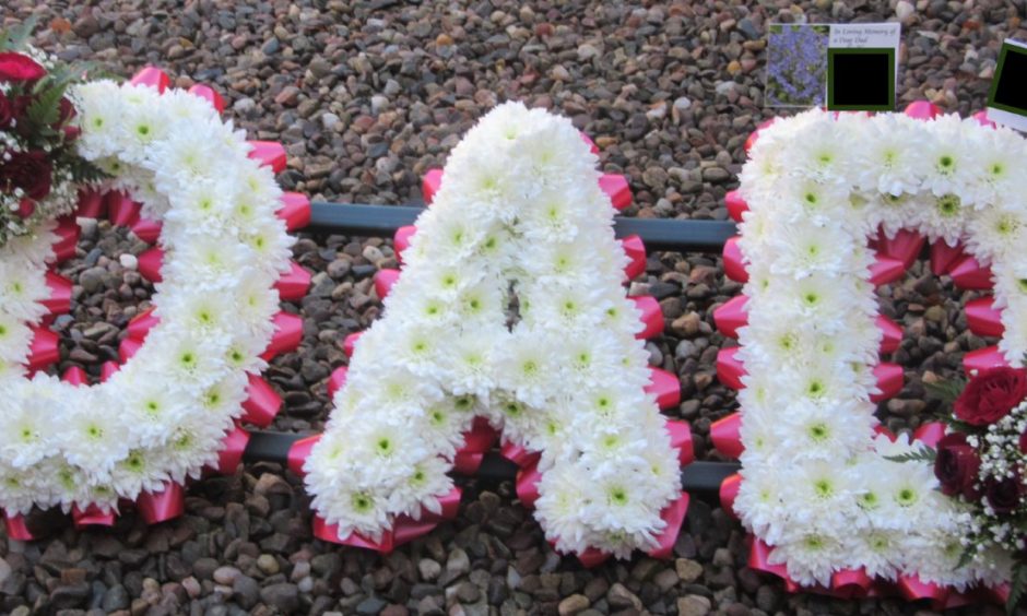 A floral tribute at William's Barclay's funeral in 2019.