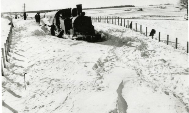 A steam train stuck in a heavy snow fall on the railway line near Auchterhouse in Angus in early 1947.