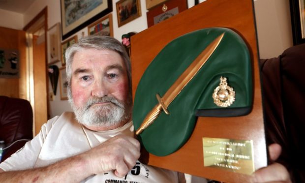 Evening telegraph/ Courier news CR0026795   G Jennings pics , 67 year old Stuart Lavery from Arbroath,  with a replica of the Royal Marine Commando Green Beret with Fairbairn Sykes Dagger Plaque which Stuart donated to ward 34 in Ninewells hospital and which has been stolen, monday 22nd february.