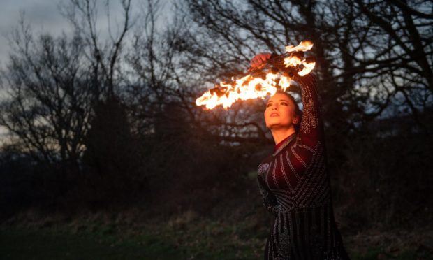 Fire performer Dawn Bryant practices at a park near her home in Birmingham. Picture date: Thursday February 11, 2021. PA Photo. The fire performer has been forced to completely 360 and take work as a carer due to the Covid-19 pandemic. Dawn Bryant used to do a large number of international choreographed shows including fire breathing, pyrotechnics and fire spinning, accompanied by music. See PA story HEALTH Coronavirus Careers. Photo credit should read: Jacob King/PA Wire