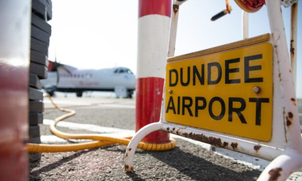 Courier / Telegraph News - Dundee  - CR0023897 - Scott Milne / Lindsay Hamilton story; first Belfast flight leaving from Dundee Airport. Picture shows; the Loganair aircraft prior to taking off for Belfast, Dundee Airport, Riverside Drive, Dundee, 18th Sept 2020. Picture by Kim Cessford / DCT Media