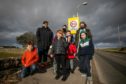 Parents and children at the speed sign in the village. Image: Kim Cessford / DC Thomson