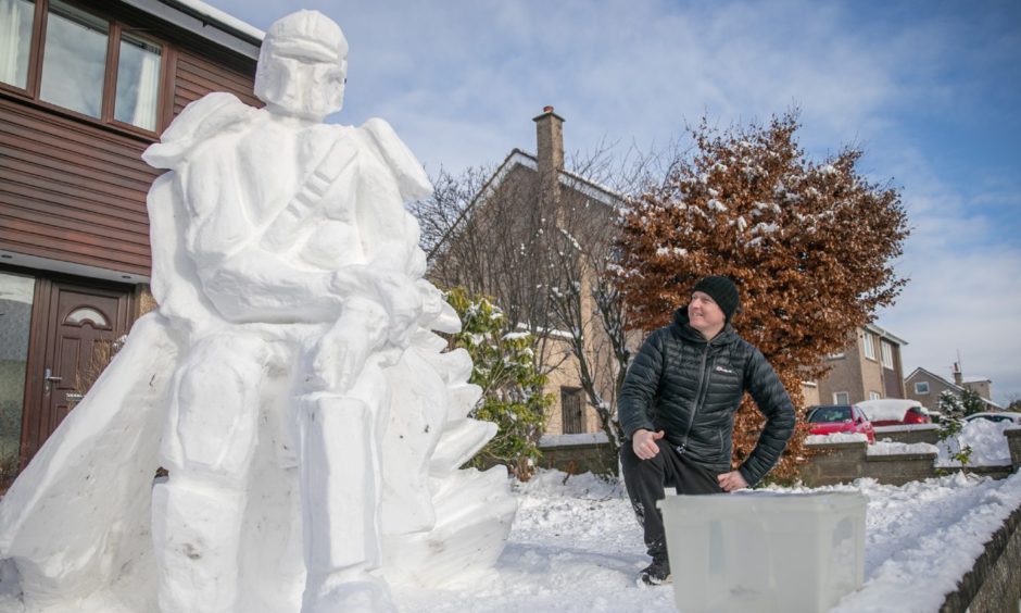 Douglas Roulston with his huge Mandalorian snowman.