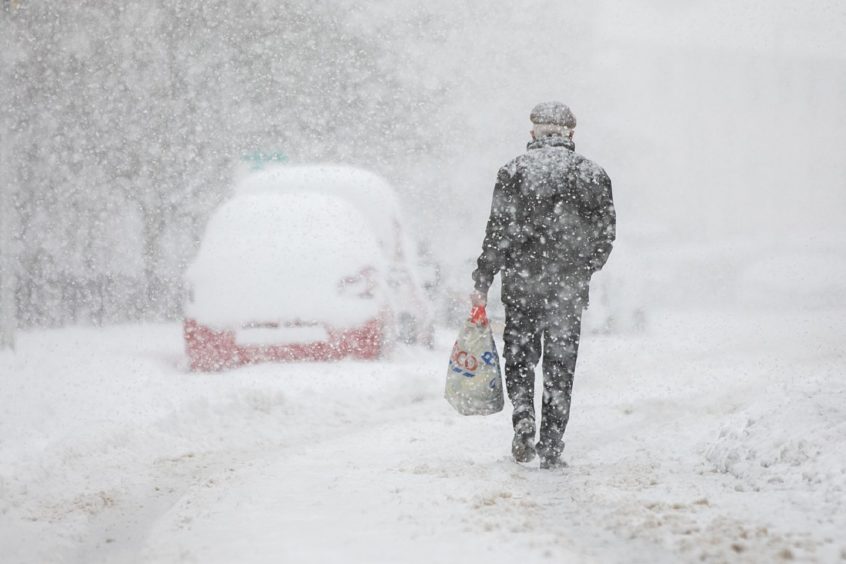 Carmichael Street, Dundee, as snow continued to fall on Wednesday.