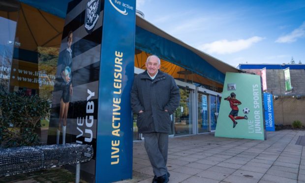 David Taylor, Chairperson of Perth and Kinross Sports Council, on the North Inch with Bells Sport centre in the background.