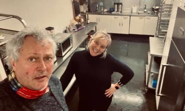 Nick and Julia Nairn at the flooded cook school.