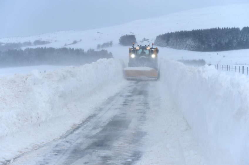 Deep snow is removed from the Nethy Bridge to Tomintoul road at Corriechullie, on Thursday, February 4 2021.