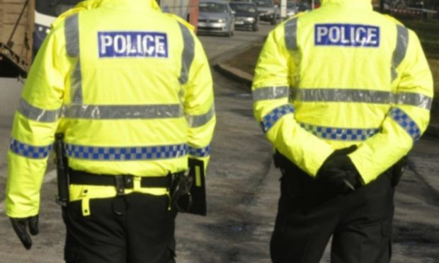 Generic picture of two police officers. Police raided the block of flats on Cross Street in Dysart on Monday.