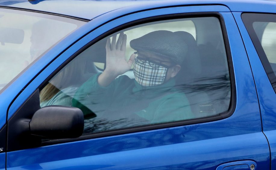 Chun Wong and his daughter Kiernan, eight, leave the DoubleTree by Hilton Hotel at Edinburgh Airport.