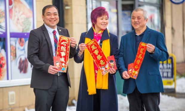 Andy Chan with mum Maria and dad Ian Chan, celebrated Chinese New Year today.