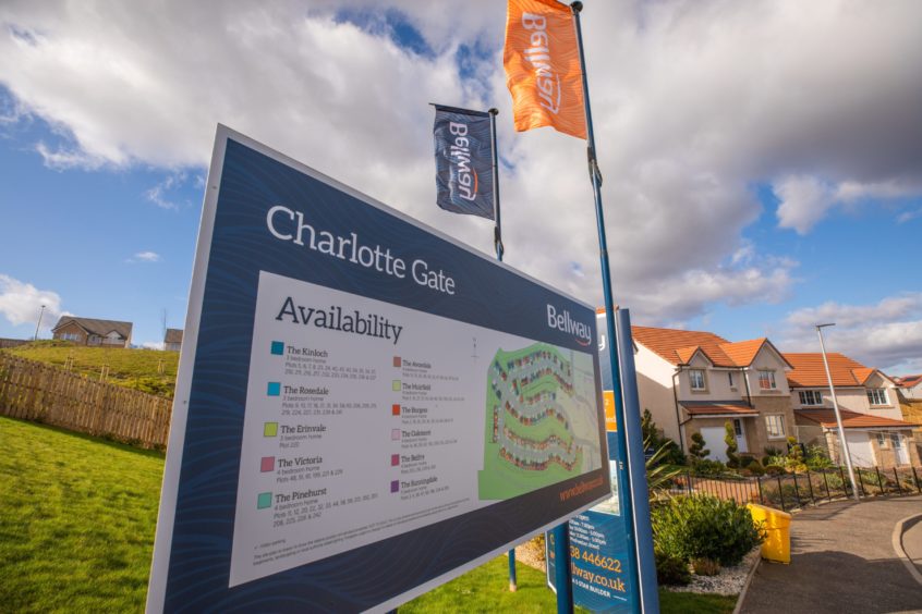 Entrance sign and flags at Charlotte Gate development in Perth