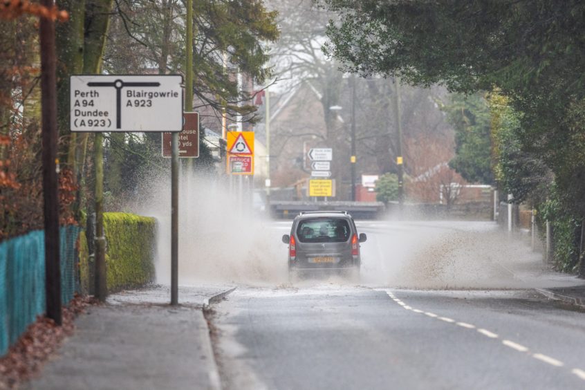 Surface water on the A94 Forfar Road, in Coupar Angus.