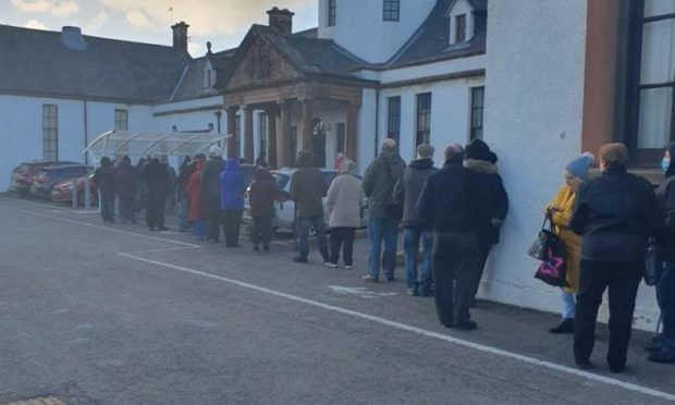 People queue outside Randolph Wemyss Hospital in Buckhaven.