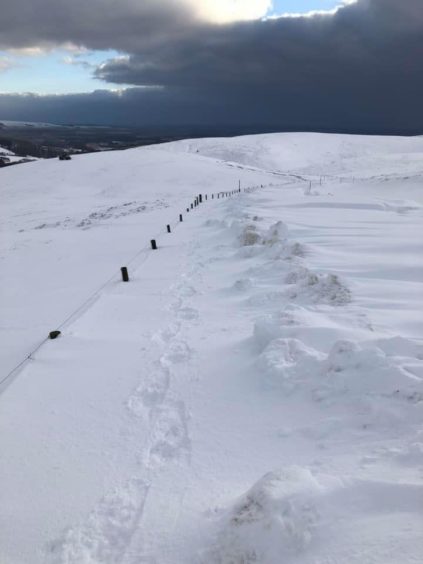 Mearns man Ralph Davidson took this image of the Cairn O' Mount road completely buried under snow.