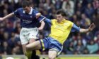 Jim Weir tackles Ian Durrant in 1998.