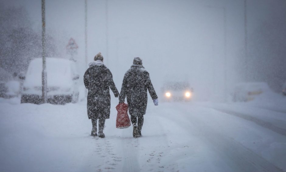 Walkers brave a blizzard on Charleston Drive, Dundee.