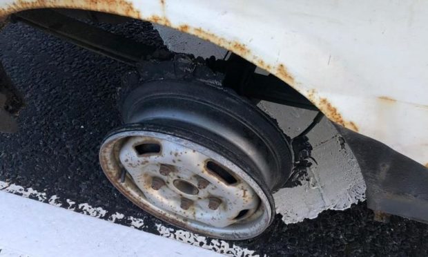 The vehicle missing a tyre was being driven on the A9 near Perth.