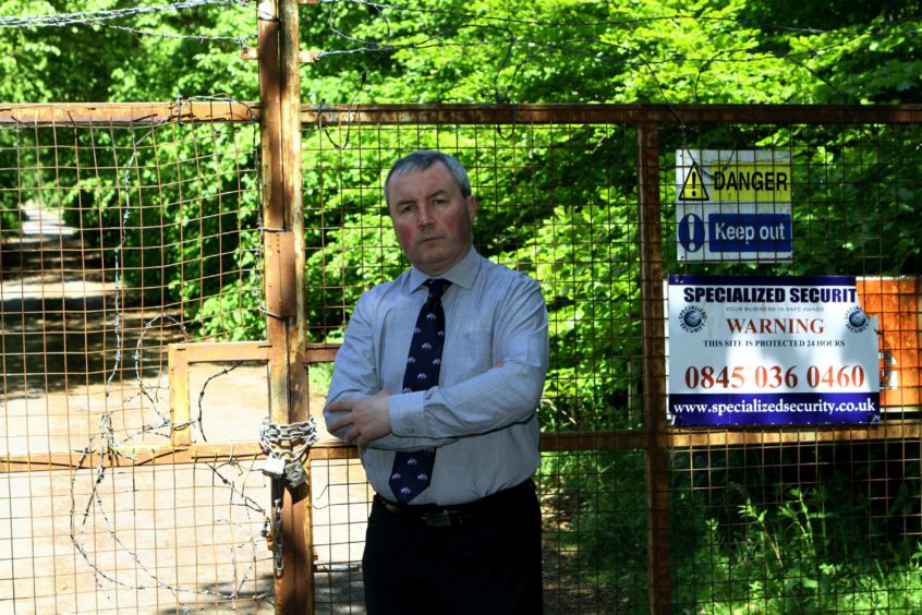 Angus councillor Craig Fotheringham at the derelict site.