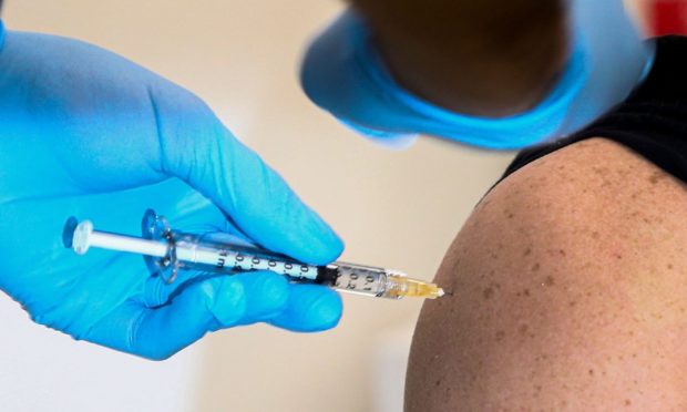 Mandatory Credit: Photo by Antonio Balasco/IPA/Shutterstock (11667167ae)
detail of vaccine injection against COVID-19. Vaccine Day in Italy, the first injections of Pfizer vaccine are given to healthcare workers at the same time.
European Vaccine Day 2020, Naples, Italy - 27 Dec 2020