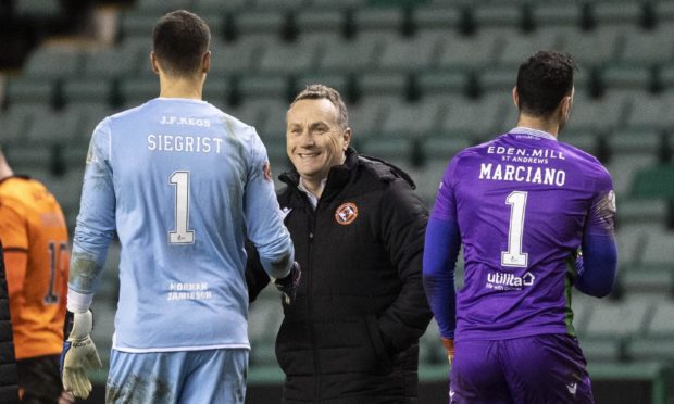 Dundee United boss Micky Mellon (centre).