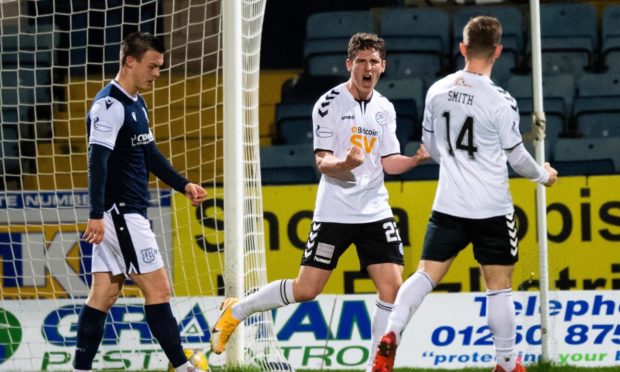 Mark McKenzie celebrates the opening goal.