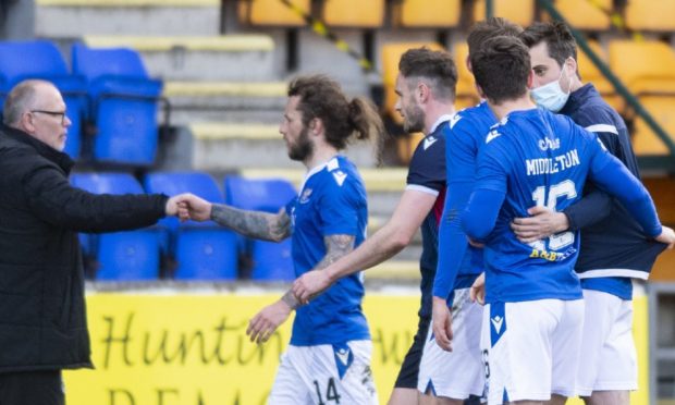The St Johnstone players celebrate making the top six.