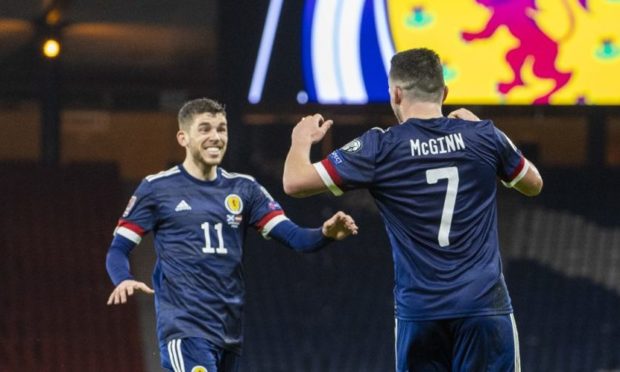 John McGinn celebrates his goal with Ryan Christie.