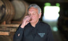 Distillery manager Doug Fitchett nosing the whisky in 1825 warehouse.