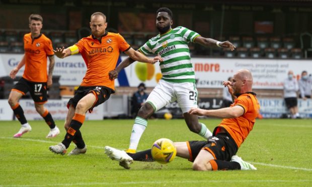 Dundee United skipper Mark Reynolds (second left) in action against Celtic back in August.